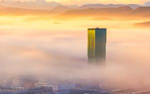 Preview wallpaper tower, building, fog, mountains, valley