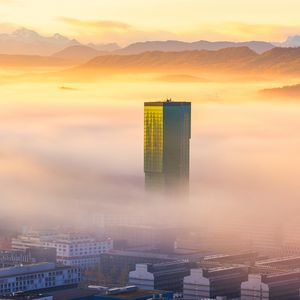 Preview wallpaper tower, building, fog, mountains, valley