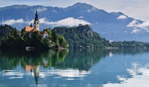 Preview wallpaper tower, building, lake, reflection, mountains