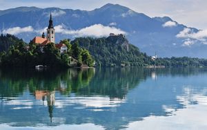 Preview wallpaper tower, building, lake, reflection, mountains