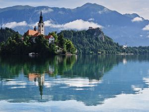 Preview wallpaper tower, building, lake, reflection, mountains