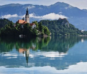 Preview wallpaper tower, building, lake, reflection, mountains