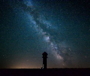 Preview wallpaper tower, building, silhouette, milky way, stars, night