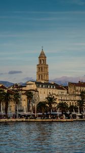 Preview wallpaper tower, buildings, architecture, palm trees, sea