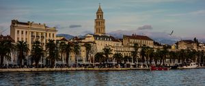 Preview wallpaper tower, buildings, architecture, palm trees, sea