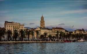 Preview wallpaper tower, buildings, architecture, palm trees, sea