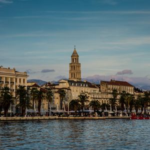 Preview wallpaper tower, buildings, architecture, palm trees, sea