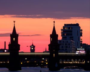 Preview wallpaper tower, buildings, bridge, river, evening