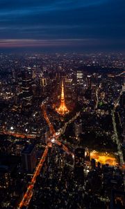 Preview wallpaper tower, buildings, city, lights, roads, aerial view