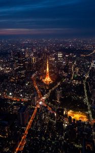 Preview wallpaper tower, buildings, city, lights, roads, aerial view