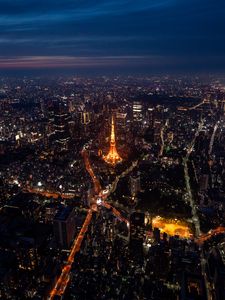 Preview wallpaper tower, buildings, city, lights, roads, aerial view