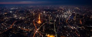 Preview wallpaper tower, buildings, city, lights, roads, aerial view