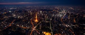 Preview wallpaper tower, buildings, city, lights, roads, aerial view