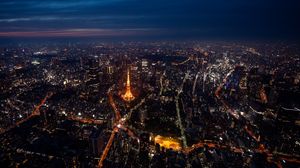 Preview wallpaper tower, buildings, city, lights, roads, aerial view