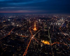 Preview wallpaper tower, buildings, city, lights, roads, aerial view