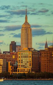 Preview wallpaper tower, buildings, clouds, nature