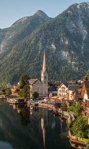 Preview wallpaper tower, buildings, houses, lake, mountains