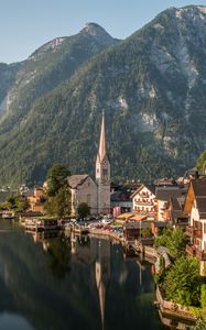 Preview wallpaper tower, buildings, houses, lake, mountains