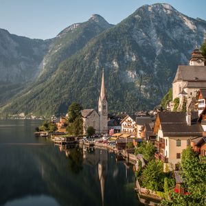 Preview wallpaper tower, buildings, houses, lake, mountains