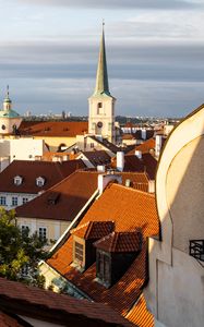 Preview wallpaper tower, buildings, houses, roofs, tiles, city