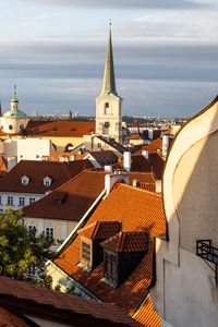 Preview wallpaper tower, buildings, houses, roofs, tiles, city