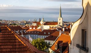 Preview wallpaper tower, buildings, houses, roofs, tiles, city