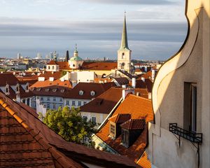 Preview wallpaper tower, buildings, houses, roofs, tiles, city