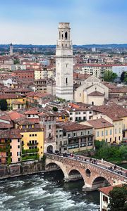 Preview wallpaper tower, buildings, houses, bridge, architecture, river, city