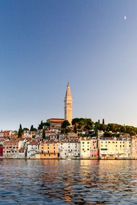 Preview wallpaper tower, buildings, houses, sea, city
