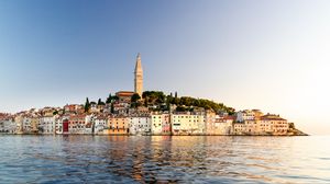 Preview wallpaper tower, buildings, houses, sea, city