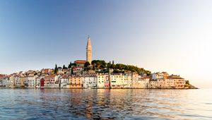 Preview wallpaper tower, buildings, houses, sea, city