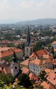 Preview wallpaper tower, buildings, houses, roofs, city, ljubljana, slovenia