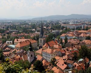 Preview wallpaper tower, buildings, houses, roofs, city, ljubljana, slovenia