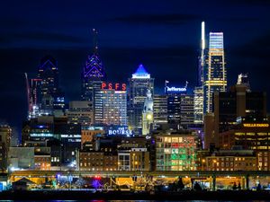 Preview wallpaper tower, buildings, lights, inscriptions, night, city