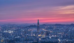 Preview wallpaper tower, buildings, lights, city, twilight
