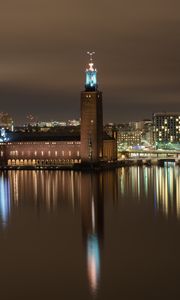 Preview wallpaper tower, buildings, lights, glow, river, night, city