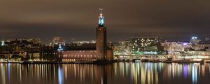 Preview wallpaper tower, buildings, lights, glow, river, night, city