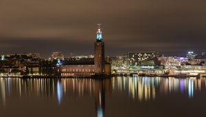 Preview wallpaper tower, buildings, lights, glow, river, night, city
