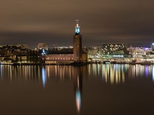 Preview wallpaper tower, buildings, lights, glow, river, night, city