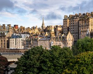 Preview wallpaper tower, buildings, roofs, architecture, trees, city