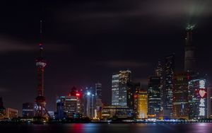 Preview wallpaper tower, buildings, sea, night, city