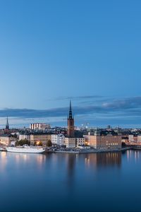 Preview wallpaper tower, buildings, ship, river, lights, city, twilight