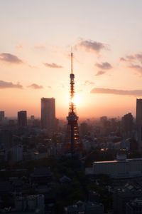 Preview wallpaper tower, buildings, sunrise, sky, city
