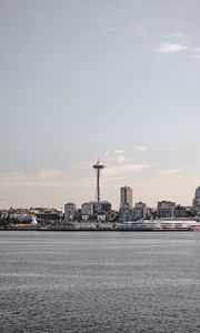 Preview wallpaper tower, city, architecture, sea, horizon