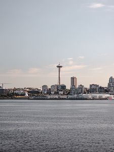 Preview wallpaper tower, city, architecture, sea, horizon