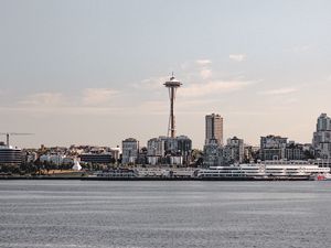 Preview wallpaper tower, city, architecture, sea, horizon