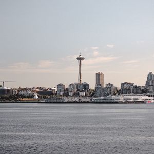 Preview wallpaper tower, city, architecture, sea, horizon