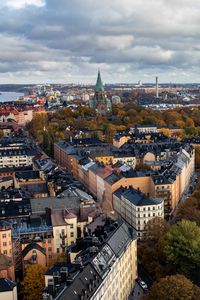 Preview wallpaper tower, city, architecture, buildings, roofs