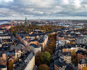 Preview wallpaper tower, city, architecture, buildings, roofs