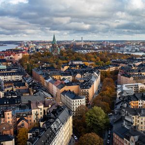 Preview wallpaper tower, city, architecture, buildings, roofs